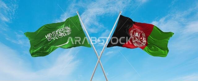 علمان متقاطعان، علم أفغانستان وعلم السعودية، يرفرفان في مهب الريح تحت سماء ملبدة بالغيوم. يرمز هذا العمل الفني إلى مفهوم العلاقة والحوار والسفر بين البلدين. رسم ثلاثي الأبعاد