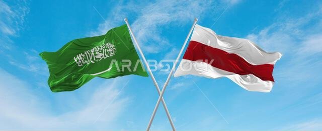 two crossed flags Belarus and Saudi Arabia waving in wind at cloudy sky. Concept of relationship, dialog, travelling between two countries. 3d illustr