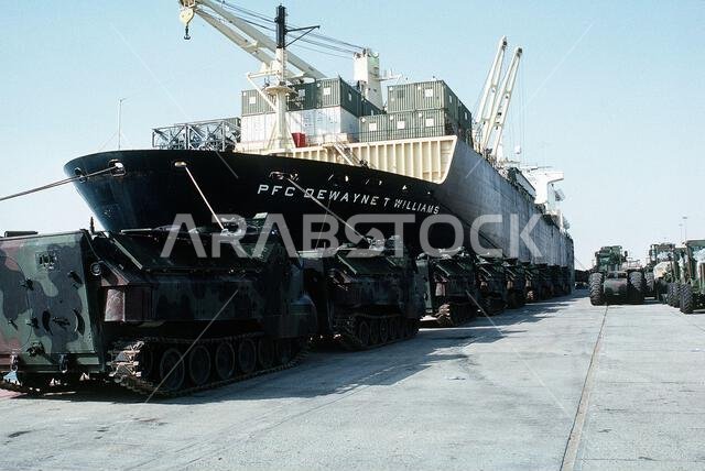 Marine Corps AAVP-7A1 amphibious assault vehicles line the pier beside the maritime pre-positioning ship PFC. DEWAYNE T. WILLIAMS (T-AK-3009) during Operation Desert Shield. Subject Operation/Series: DESERT SHIELD Base: Jubail Country: Saudi Arabia (SAU) Marine Corps AAVP-7A1 amphibious assault vehicles line the pier beside the maritime pre-positioning ship PFC. DEWAYNE T. WILLIAMS (T-AK-3009) during Operation Desert Shield. Subject Operation/Series: DESERT SHIELD Base: Jubail Country: Saudi Arabia (SAU)