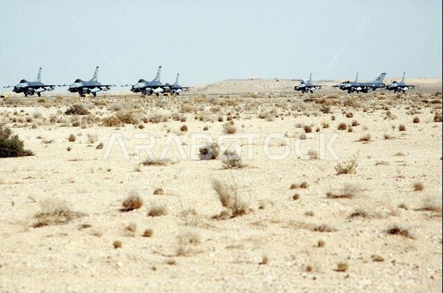 F-16C Fighting Falcon fighter aircraft of the 421st Tactical Fighter Wing line an airfield prior to a mission during Operation Desert Storm.. Subject Operation/Series: DESERT STORM Country: Saudi Arabia(SAU)
