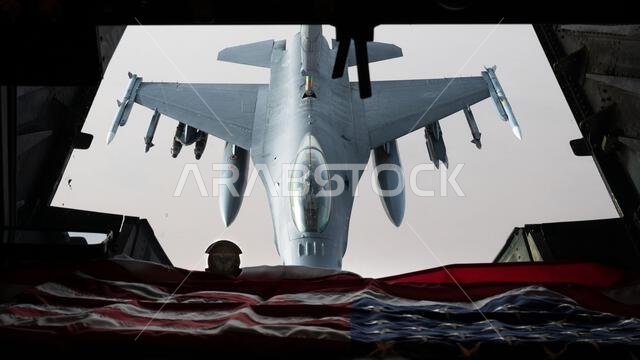 A U.S. Air Force F-16 Fighting Falcon is refueled by a KC-10 Extender over the U.S. Central Command area of responsibility, April 7, 2022. The KC-10 is an advanced tanker and cargo aircraft that delivers Ninth Air Force (Air Forces Central)’s global reach aerial refueling capability to support joint and partner nation aircraft throughout the U.S. Central Command area of responsibility.