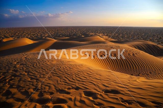 Sunset over the sand dunes of the Arabian Desert in Oman