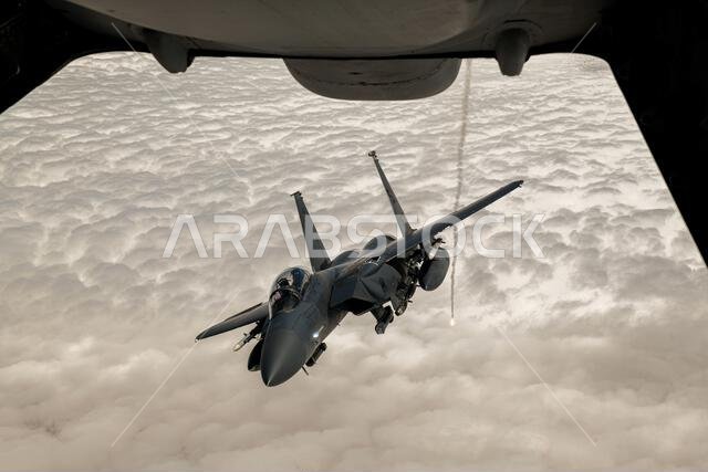U.S. Airmen with the 378th Air Expeditionary Wing watch an F-15 Eagle aircraft demonstrate its flare system behind a KC-10 Extender, assigned to the 908th Expeditionary Air Refueling Squadron, during an orientation flight, above AFCENT’s area of responsibility, April 27, 2022. The purpose of the orientation flight was to expose Airmen of the 378th AEW to the wing’s flying mission that normally don’t have an opportunity to see it up close. (U.S. Air Force photo/Staff Sgt. Noah J. Tancer) 378th Ai U.S. Airmen with the 378th Air Expeditionary Wing watch an F-15 Eagle aircraft demonstrate its flare system behind a KC-10 Extender, assigned to the 908th Expeditionary Air Refueling Squadron, during an orientation flight, above AFCENT’s area of responsibility, April 27, 2022. The purpose of the orientation flight was to expose Airmen of the 378th AEW to the wing’s flying mission that normally don’t have an opportunity to see it up close. (U.S. Air Force photo/Staff Sgt. Noah J. Tancer) 378th Ai