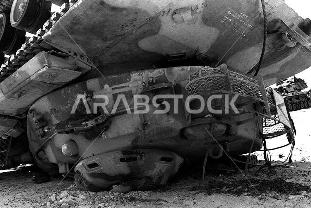 A close-up view of a B Co., 3rd Tank Battalion, 1ST Marine Division, M-60A1 main battle tank that fell off a trailer during Operation Desert Shield. Subject Operation/Series: DESERT SHIELD Country: Saudi Arabia (SAU) A close-up view of a B Co., 3rd Tank Battalion, 1ST Marine Division, M-60A1 main battle tank that fell off a trailer during Operation Desert Shield. Subject Operation/Series: DESERT SHIELD Country: Saudi Arabia (SAU)