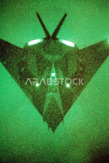 As seen through a night vision lens, a 37th Tactical Fighter Wing (37th TFW) F-117A aircraft moves in for a midair refueling during Operation Desert Shield. Subject Operation/Series: DESERT SHIELD Country: Saudi Arabia (SAU)