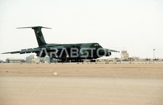 A C-5 Galaxy aircraft rolls along a runway after landing at an air base during Operation Desert Shield. Subject Operation/Series: DESERT SHIELD Country: Saudi Arabia (SAU) A C-5 Galaxy aircraft rolls along a runway after landing at an air base during Operation Desert Shield. Subject Operation/Series: DESERT SHIELD Country: Saudi Arabia (SAU)