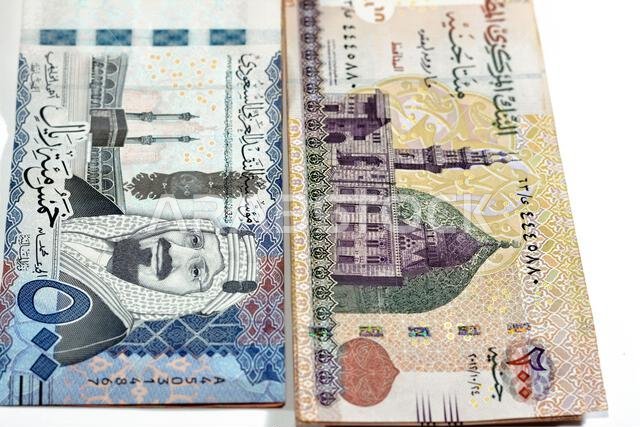Five hundred Saudi Arabia riyals cash money banknote 500 SAR features king AbdulAziz Al Saud and Kabaa with 200 LE EGP two hundred Egyptian pounds fea