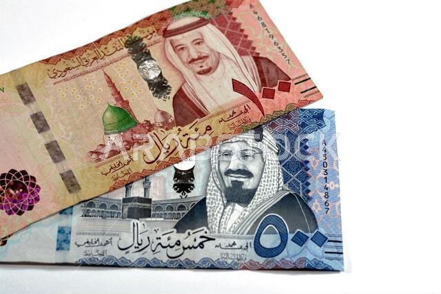 500 SAR Five hundred Saudi Arabia riyals cash money with king AbdulAziz Al Saud and Kabaa and 100 SAR one hundred Saudi Arabia riyals banknote with ki