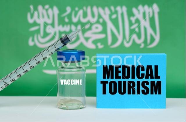 Medicine concept. Vaccine, syringe and blue plate with the inscription - MEDICAL TOURISM. In the background the flag of Saudi Arabia Medicine concept. Vaccine, syringe and blue plate with the inscription - MEDICAL TOURISM. In the background the flag of Saudi Arabia
