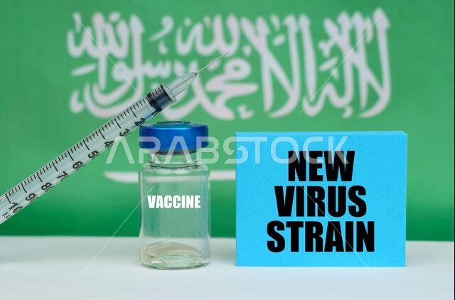 Medicine concept. Vaccine, syringe and blue plate with the inscription - new virus strain. In the background the flag of Saudi Arabia Medicine concept. Vaccine, syringe and blue plate with the inscription - new virus strain. In the background the flag of Saudi Arabia