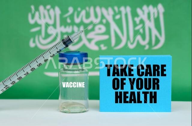 Medicine concept. Vaccine, syringe and blue plate with the inscription - Take care of your health. In the background the flag of Saudi Arabia