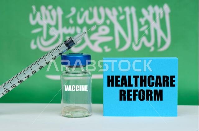 Medicine concept. Vaccine, syringe and blue plate with the inscription - HEALTHCARE REFORM. In the background the flag of Saudi Arabia