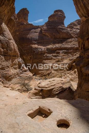 Canyon with strange possibly prehistoric wells near Al Ula Saudi Arabia Canyon with strange possibly prehistoric wells near Al Ula Saudi Arabia