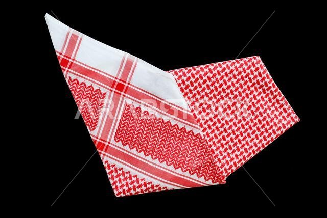 saudi men clothing accessory head scarf red shemagh closeup black background space for text luxury traditional Arabic men dressing