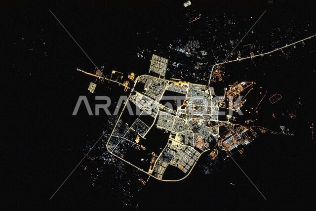 ISS captures Tabuk, Saudi Arabia at night from 260 miles above, showing urban lights near the Jordanian border.