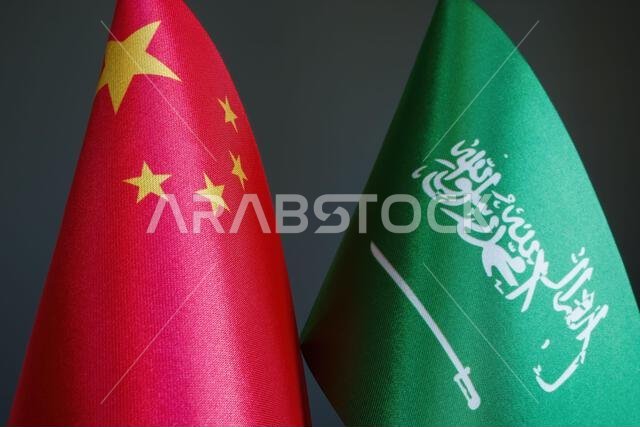 Flags of China and Saudi Arabia as a symbol of diplomacy.