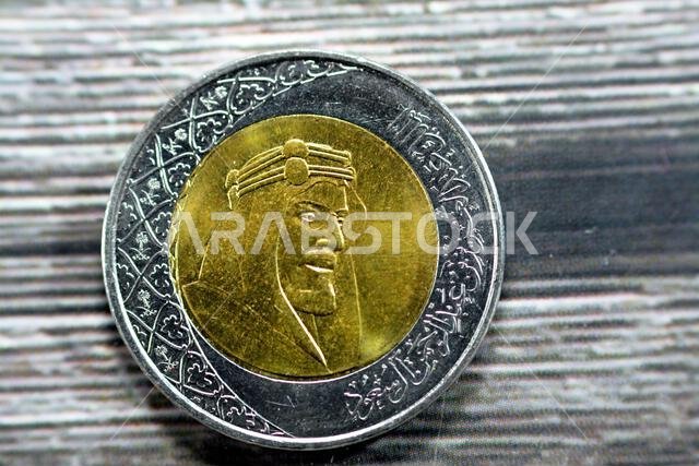 Obverse side of 2 SAR two Saudi Arabia riyals coin series 1438 AH 2016 features portrait of king AbdulAziz Bin AbdulRahman Al Saud the founder of dyna Obverse side of 2 SAR two Saudi Arabia riyals coin series 1438 AH 2016 features portrait of king AbdulAziz Bin AbdulRahman Al Saud the founder of dyna