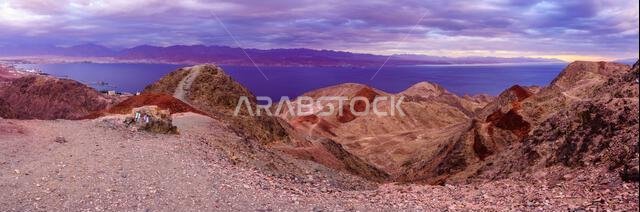 Panoramic winter sunset view of the Gulf of Aqaba, and the borders meeting of Israel, Jordan, Saudi Arabia, and Egypt. Mount Tzfahot, southern Israel Panoramic winter sunset view of the Gulf of Aqaba, and the borders meeting of Israel, Jordan, Saudi Arabia, and Egypt. Mount Tzfahot, southern Israel