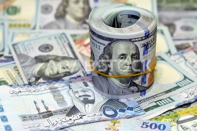 Saudi Arabia riyals money banknotes of 500 riyals, 100 and 50 riyal with USA American cash money banknotes of 100 $ one hundred dollars and American m