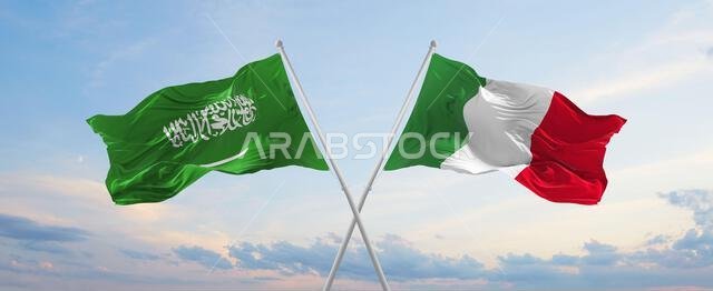 two crossed flags Saudi Arabia and Italy waving in wind at cloudy sky. Concept of relationship, dialog, travelling between two countries. 3d illustrat two crossed flags Saudi Arabia and Italy waving in wind at cloudy sky. Concept of relationship, dialog, travelling between two countries. 3d illustrat