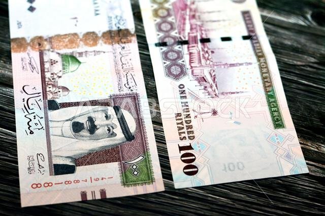 وجه وظهر ورقة نقدية سعودية من فئة 100 ريال سعودي، تحمل صورة الملك عبد الله بن عبد العزيز، والنبي محمد صلى الله عليه وسلم.