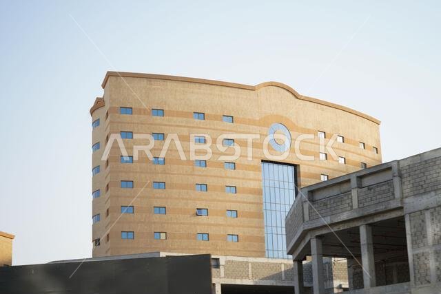 blue sky tall building, with some structures. Saudi Arabia, Khobar, 10, June 2022.
