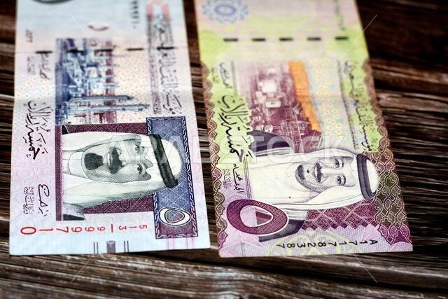ورقة نقدية من فئة 5 ريالات سعودية تحمل صورة الملك سلمان والملك عبد الله ومصفاة الشيبة النفطية ومصفاة رأس تنورة النفطية ورقة نقدية من فئة 5 ريالات سعودية تحمل صورة الملك سلمان والملك عبد الله ومصفاة الشيبة النفطية ومصفاة رأس تنورة النفطية