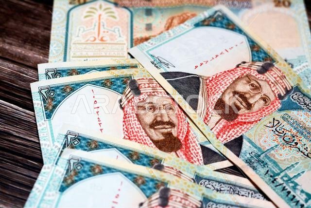 ورقة نقدية سعودية من فئة 20 ريالاً سعودياً، تحمل صورة الملك عبد العزيز آل سعود، ومسجد قباء في المدينة المنورة، وجبل النور.
