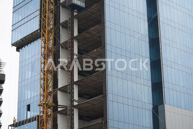 a huge building, lots of tower Construction sites with cranes and buildings, Khobar, Saudi Arabia, December 31, 2021.