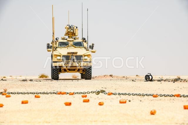 U.S. Air Force explosive ordnance disposal technicians assigned to the 378th Expeditionary Civil Engineer Squadron, prepare a winch for remote munitions removal during Rapid Explosive Hazard Mitigation training at Prince Sultan Air Base, Kingdom of Saudi Arabia, June 24, 2022. The training was held to prepare and test current personnel in their ability to get the airfield back up and running with available resources after an attack. (U.S. Air Force photo by Staff Sgt. Noah J. Tancer)