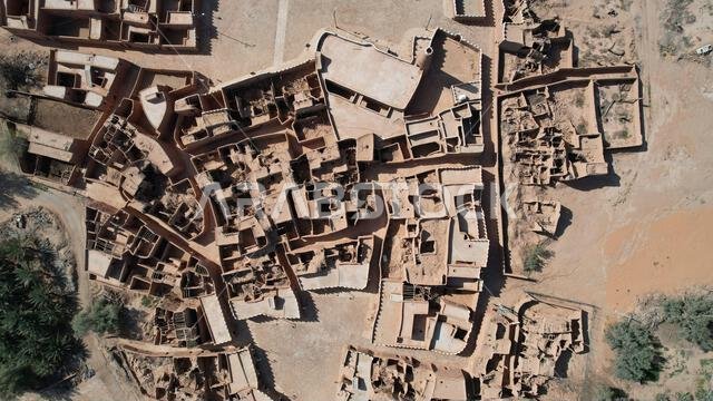 An aerial shot of sandy buildings in the dessert of Saudi Arabia