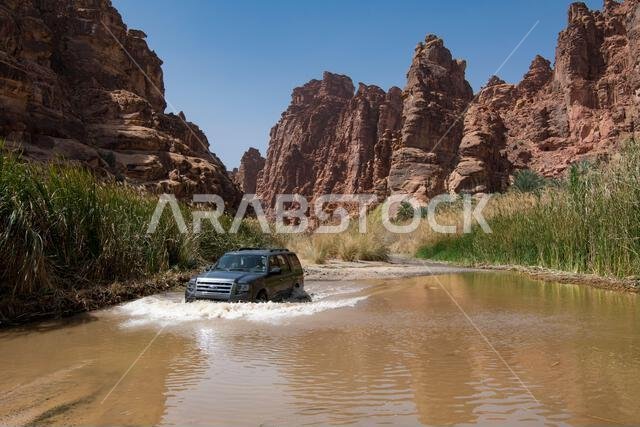 4WD crossing flooded track Wadi Disah Tabuk Province Saudi Arabia 4WD crossing flooded track Wadi Disah Tabuk Province Saudi Arabia