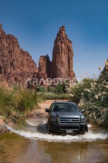 4WD fording flooded track Wadi Disah Tabuk Province Saudi Arabia