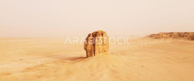A single sandstone structure in the middle of the desert in Judah, Saudi Arabia.