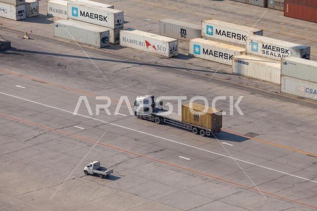 Dammam, Saudi Arabia - December 26, 2019: Container truck is in port of Dammam, aerial view