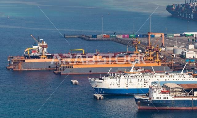 Jeddah, Saudi Arabia - December 22, 2019: Jeddah port on a daytime, aerial view with cargo ships and dry docks Jeddah, Saudi Arabia - December 22, 2019: Jeddah port on a daytime, aerial view with cargo ships and dry docks