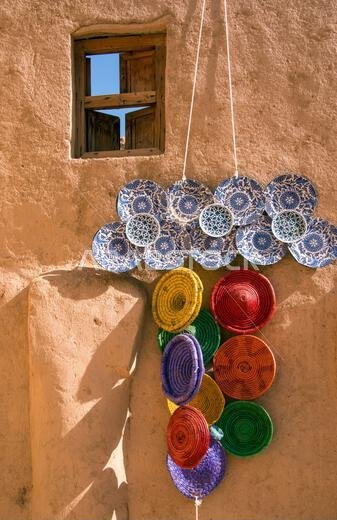 Colourful hanging baskets and plates Al Ula Old Town saudia Arabia Colourful hanging baskets and plates Al Ula Old Town saudia Arabia