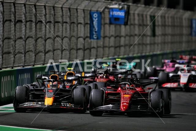 Jeddah, Saudi Arabia. 27th Mar, 2022. Max Verstappen (NLD) Red Bull Racing RB18 and Charles Leclerc (MON) Ferrari F1-75 battle for the lead of the race. Saudi Arabian Grand Prix, Sunday 27th March 2022. Jeddah, Saudi Arabia. Credit: James Moy/Alamy Live News