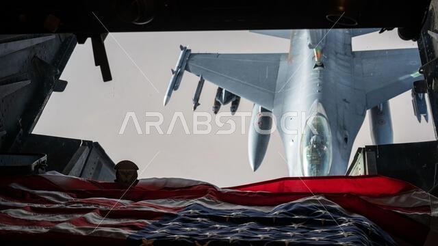 A U.S. Air Force F-16 Fighting Falcon is refueled by a KC-10 Extender over the U.S. Central Command area of responsibility, April 7, 2022. The KC-10 is an advanced tanker and cargo aircraft that delivers Ninth Air Force (Air Forces Central)’s global reach aerial refueling capability to support joint and partner nation aircraft throughout the U.S. Central Command area of responsibility. (U.S. Air Force photo by Senior Airman Jacob B. Wrightsman)