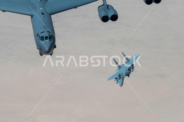 A Royal Saudi Air Force F-15 flies with a U.S. Air Force B-52H Stratofortress above the Kingdom of Saudi Arabia, March 29, 2022. The bomber’s flight originated at Royal Air Force Fairford, England, and flew over the East Mediterranean, Arabian Peninsula, and Red Sea before departing the region. (U.S. Air Force photo by Staff Sgt. Joseph Pick) A Royal Saudi Air Force F-15 flies with a U.S. Air Force B-52H Stratofortress above the Kingdom of Saudi Arabia, March 29, 2022. The bomber’s flight originated at Royal Air Force Fairford, England, and flew over the East Mediterranean, Arabian Peninsula, and Red Sea before departing the region. (U.S. Air Force photo by Staff Sgt. Joseph Pick)