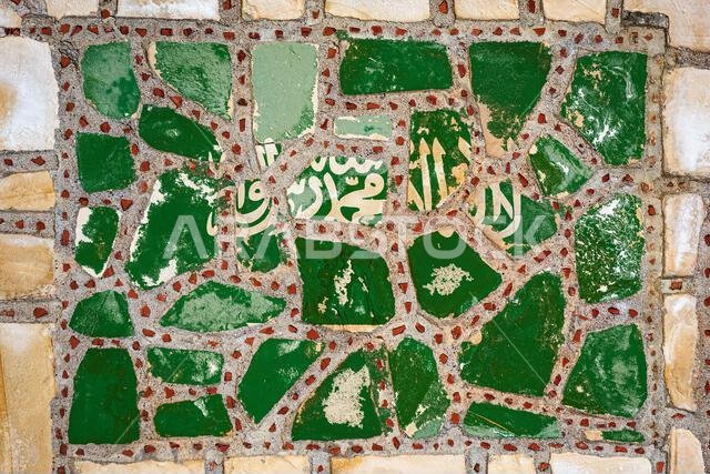 National flag of  Saudi Arabia on stone  wall background. Flag  banner on  stone texture background.