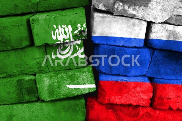 مفهوم العلاقة بين المملكة العربية السعودية وروسيا من خلال علمين مرسومين على جدار من الطوب المتضرر مفهوم العلاقة بين المملكة العربية السعودية وروسيا من خلال علمين مرسومين على جدار من الطوب المتضرر