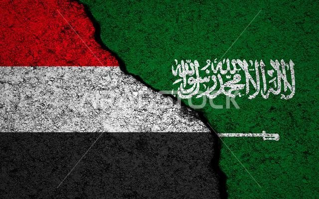 Yemen and Saudi Arabia flags background. Cracked wall. Houthi-Saudi Arabian conflict and war concept