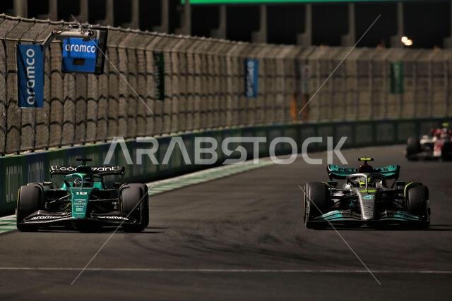 Lance Stroll (CDN) Aston Martin F1 Team AMR22 and Lewis Hamilton (GBR) Mercedes AMG F1 W13 battle for position. Saudi Arabian Grand Prix, Sunday 27th March 2022. Jeddah, Saudi Arabia.