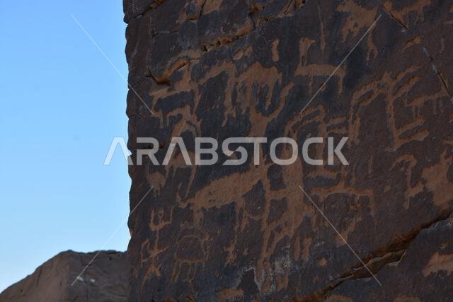 Ancient rock art from Saudi Arabia showing human and animals