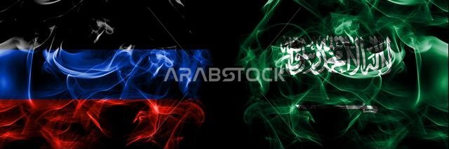 جمهورية دونيتسك الشعبية ضد المملكة العربية السعودية، علم عربي. أعلام دخان موضوعة جنباً إلى جنب معزولة على خلفية سوداء.