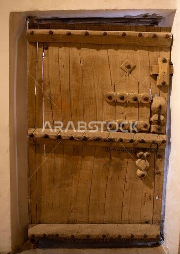 Old wooden door in Musmak fort, Riyadh Province, Riyadh, Saudi Arabia