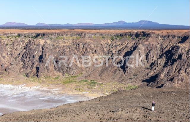 saudi man at the dormant Wahba crater in Saudi Arabia saudi man at the dormant Wahba crater in Saudi Arabia