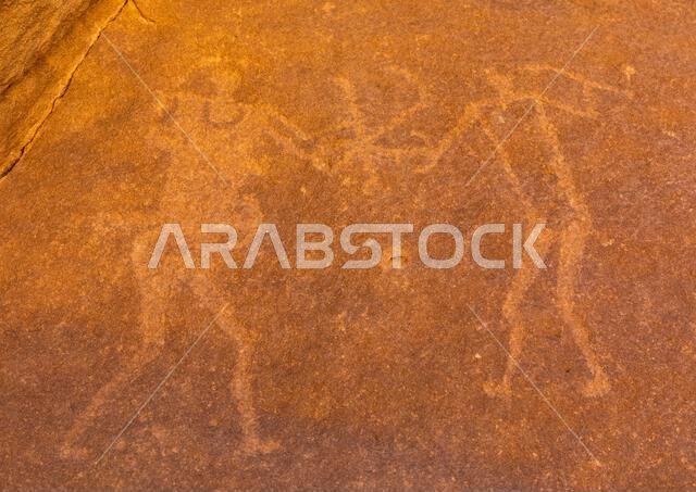Petroglyphs on a rock depicting men fighting, Najran Province, Thar, Saudi Arabia