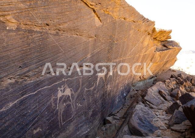 Petroglyphs on a rock depicting hunters riding horses, Najran Province, Thar, Saudi Arabia Petroglyphs on a rock depicting hunters riding horses, Najran Province, Thar, Saudi Arabia